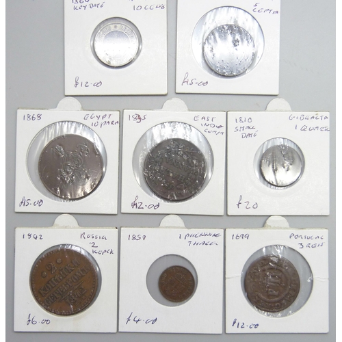 1061 - A collection of seven worldwide coins; a 1699 Portuguese 3 reis and six 19th Century including an 18... 