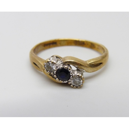 1070 - A 9ct gold sapphire and diamond three stone ring, 2g, L