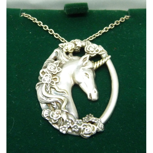 1073 - A hallmarked silver unicorn pendant and chain, pendant 33mm wide