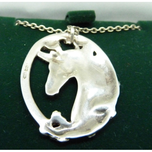 1073 - A hallmarked silver unicorn pendant and chain, pendant 33mm wide