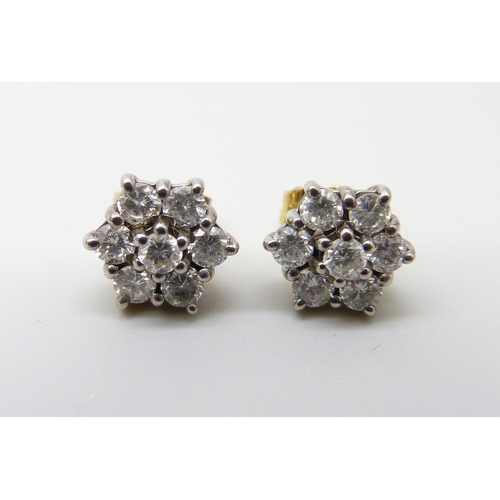 1083 - A pair of 18ct gold brilliant cut diamond daisy cluster stud earrings, approximately 1ct diamond wei... 