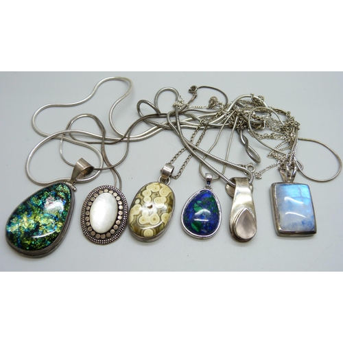 1089 - Six silver mounted pendants and chains