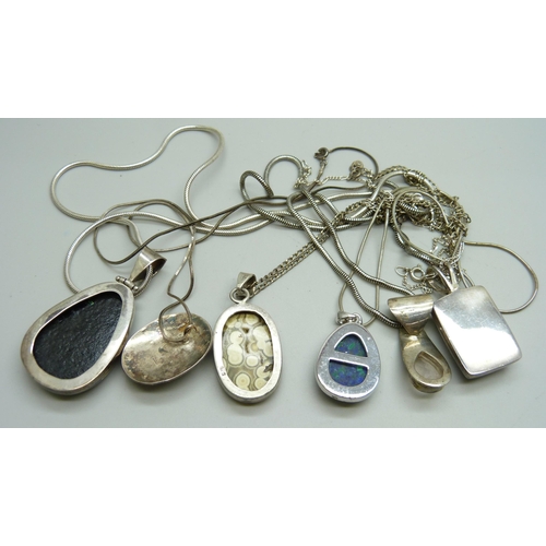 1089 - Six silver mounted pendants and chains