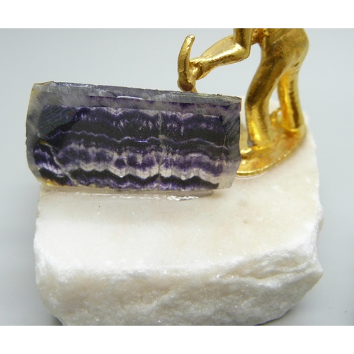 1101 - A Blue John brooch, (crack in the stone), two Blue John geological samples and Blue John in resin on... 