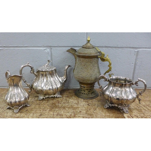 1104 - A three piece plated tea service and an Eastern tea pot **PLEASE NOTE THIS LOT IS NOT ELIGIBLE FOR I... 