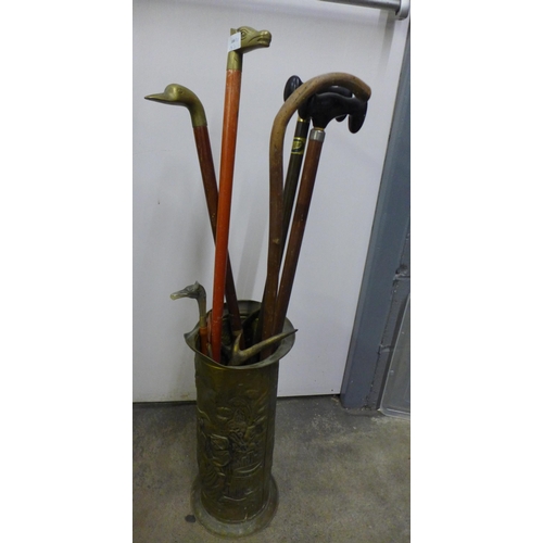 1115 - A box of mixed metalwares, barometer, stick stand and walking sticks **PLEASE NOTE THIS LOT IS NOT E... 