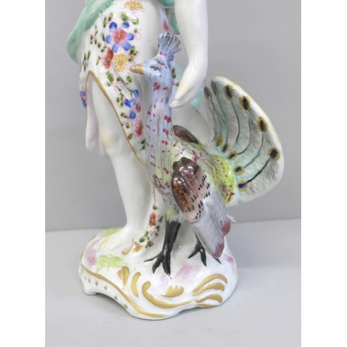 601 - A 19th Century porcelain figure of Juno and the Peacock, 26.5cm