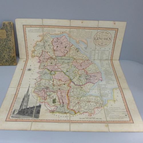 628 - An early 19th Century hand coloured map of Lincoln/Lincolnshire and a compass