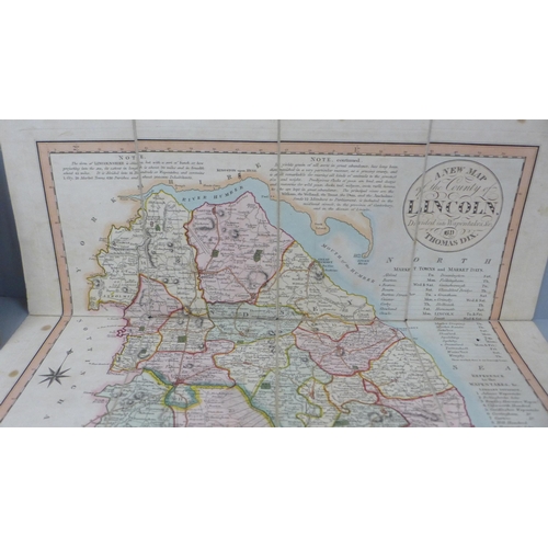 628 - An early 19th Century hand coloured map of Lincoln/Lincolnshire and a compass