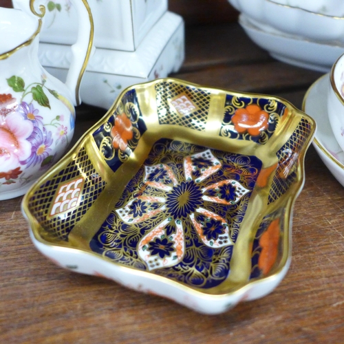 629 - A pair of Royal Crown Derby Derby Posies candlesticks, four pin trays, jug, a 1128 pattern pin dish,... 