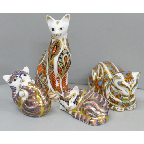 634 - Four Royal Crown Derby cat paperweights, two with gold and two with silver stoppers