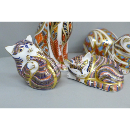 634 - Four Royal Crown Derby cat paperweights, two with gold and two with silver stoppers