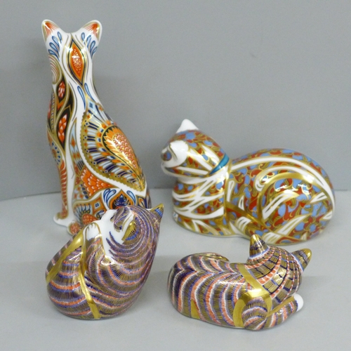 634 - Four Royal Crown Derby cat paperweights, two with gold and two with silver stoppers