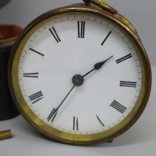 639 - A travel clock, Swiss movement with key, cased