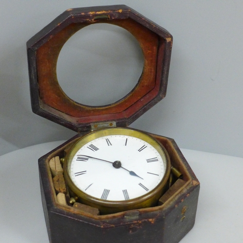 639 - A travel clock, Swiss movement with key, cased