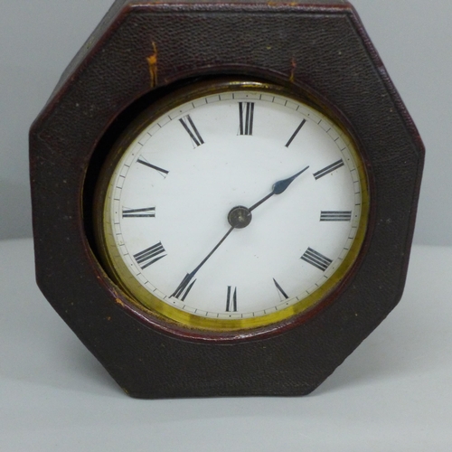 639 - A travel clock, Swiss movement with key, cased