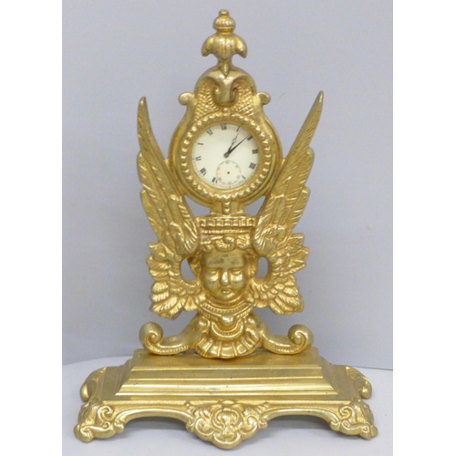 642 - A brass pocket watch stand with gold plated top-wind pocket watch