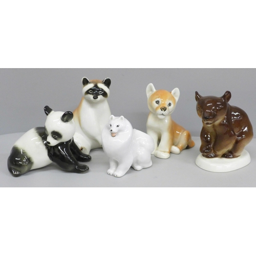 651 - A collection of USSR porcelain animal figures including racoon, bear, lion cub and panda