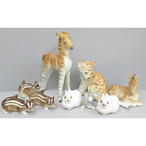 654 - A collection of nine USSR porcelain animal figures including giraffe calf, rabbits and zebra, one a/... 