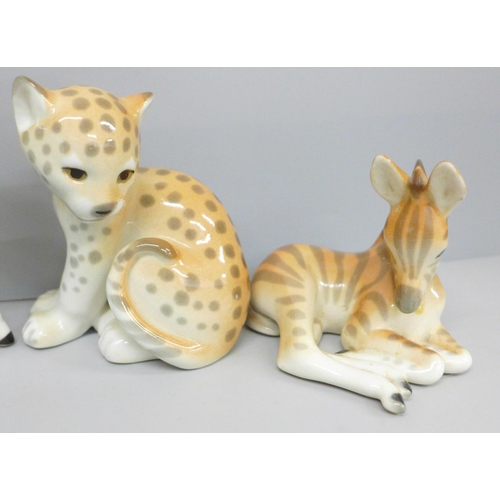 654 - A collection of nine USSR porcelain animal figures including giraffe calf, rabbits and zebra, one a/... 