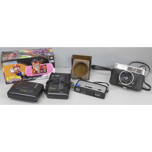 663 - Assorted cameras, pocket watch stand, Crash Bandicoot PVP station, etc.