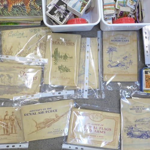 666 - A large quantity of cigarette cards including 28 John Player complete albums