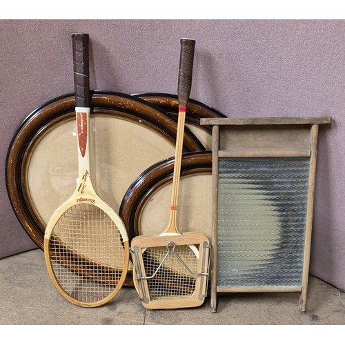 366 - Three oval picture frames, two vintage tennis rackets and a washboard