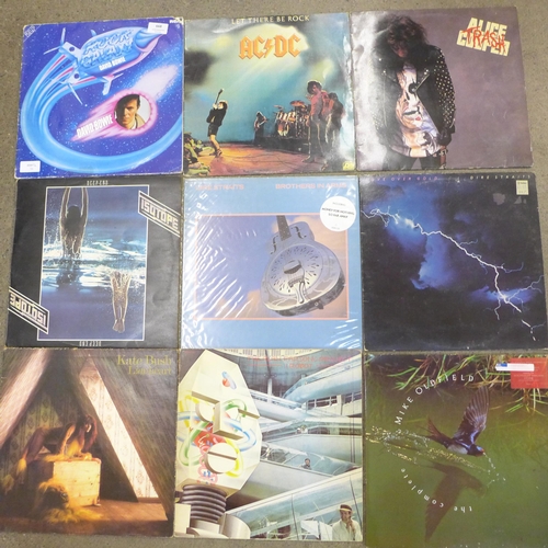 668 - A collection of 10 LP records including AC/DC, Kate Bush and David Bowie