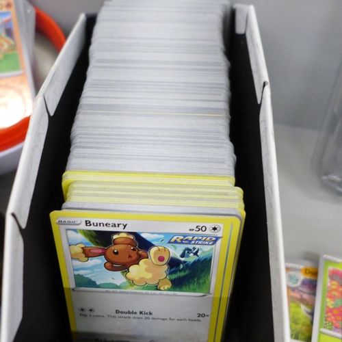 700 - Over five hundred Pokemon cards, two balls plus promos