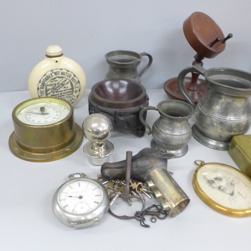 702 - A Smiths brass barometer, pocket hot water bottle, brass clock, three pewter mugs, pocket watch a/f,... 