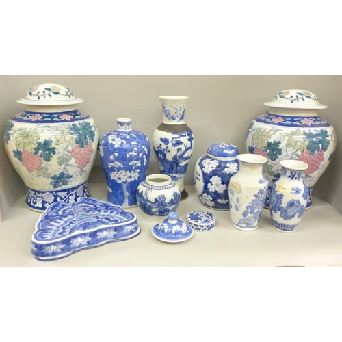 717 - Two boxes of oriental blue and white china including ginger jars, vases and a pair of table lamp bas... 