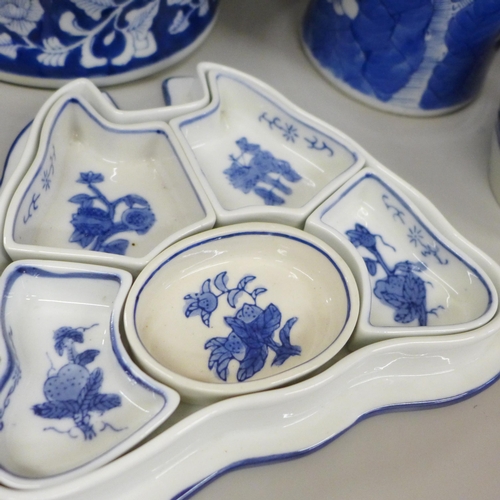 717 - Two boxes of oriental blue and white china including ginger jars, vases and a pair of table lamp bas... 