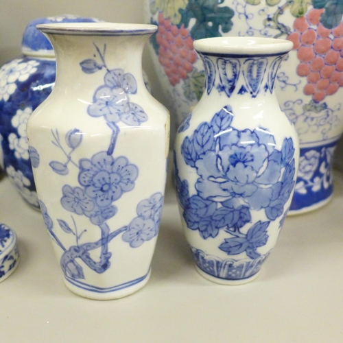 717 - Two boxes of oriental blue and white china including ginger jars, vases and a pair of table lamp bas... 