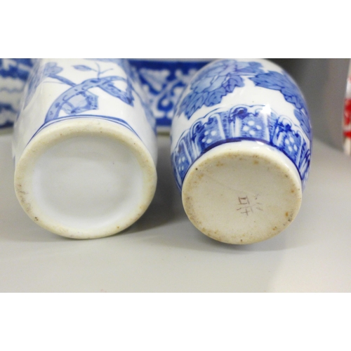 717 - Two boxes of oriental blue and white china including ginger jars, vases and a pair of table lamp bas... 