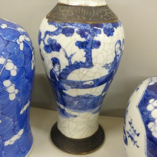 717 - Two boxes of oriental blue and white china including ginger jars, vases and a pair of table lamp bas... 