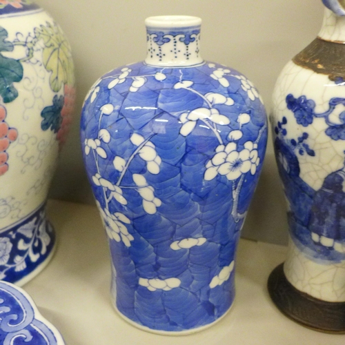 717 - Two boxes of oriental blue and white china including ginger jars, vases and a pair of table lamp bas... 