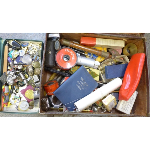 724 - A small case of assorted items including whistles, badges, advertising, etc.