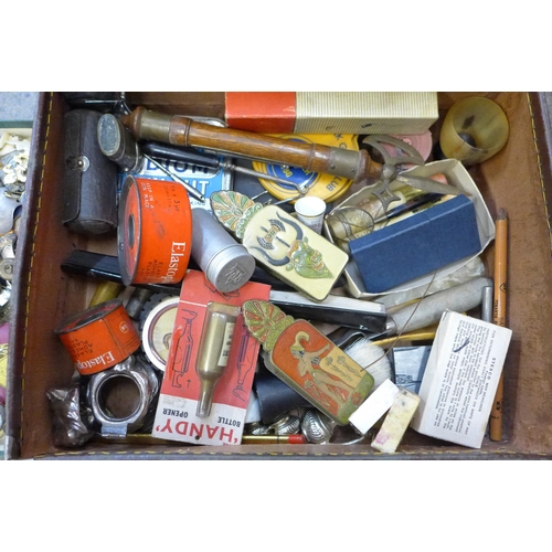 724 - A small case of assorted items including whistles, badges, advertising, etc.