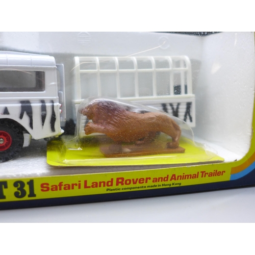 737 - A Corgi Gift Set 31 Safari Land Rover and Animal Trailer with lion and game warden