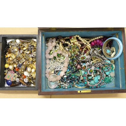 753 - A box of costume jewellery and a box of earrings