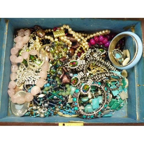 753 - A box of costume jewellery and a box of earrings