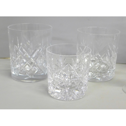 776 - A suite of crystal glassware including tumblers and wines of different sizes, decanters, jugs, bowl,... 