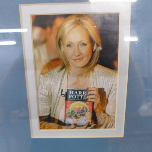 787 - A framed and mounted display, signed by J.K. Rowling, no COA