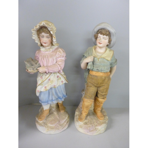 794 - A pair of continental bisque figures, Lladro Polar Bear, Nao clown, etc