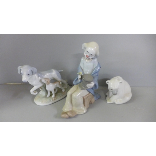 794 - A pair of continental bisque figures, Lladro Polar Bear, Nao clown, etc