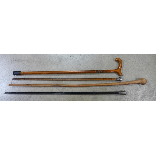 802 - Two silver topped walking canes and two others