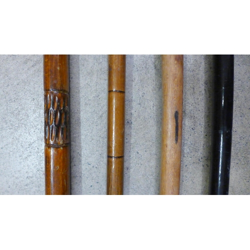 802 - Two silver topped walking canes and two others