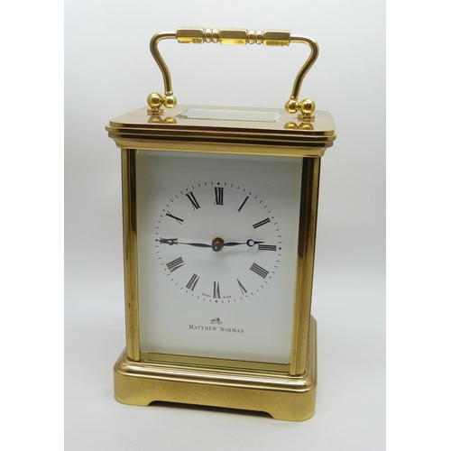 816 - A Matthew Norman gilt brass timepiece with striking movement, Swiss movement, with key