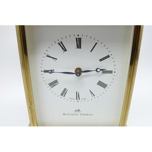 816 - A Matthew Norman gilt brass timepiece with striking movement, Swiss movement, with key