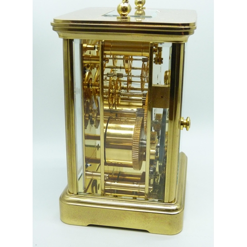 816 - A Matthew Norman gilt brass timepiece with striking movement, Swiss movement, with key